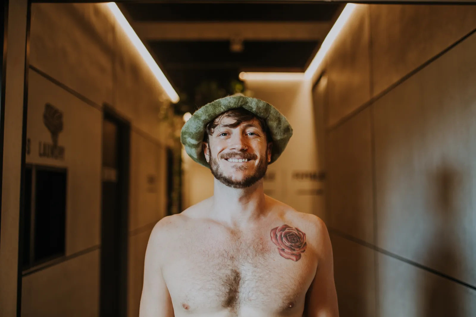 Workshop participant wearing his finished green felt sauna hat